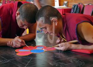 Two Tibetan Monks starting the Sand Mandala Day 1