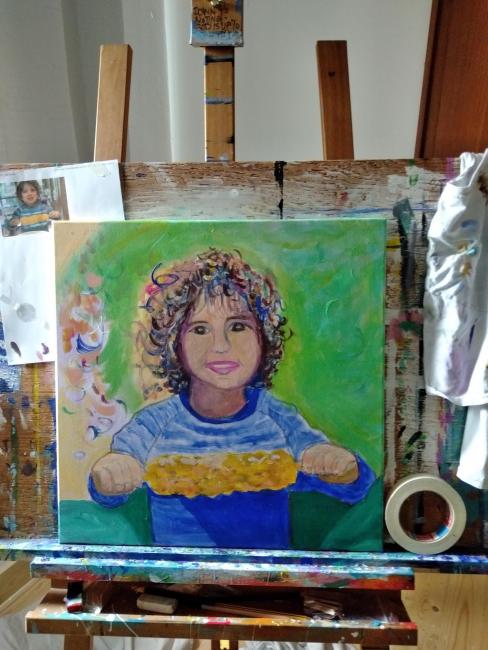 Boy with corn on the cob by Christina Jarmolinski