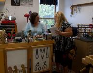 Mimi Harris in her jewelry studio at CAN with Chrisitna