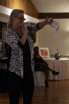 Ginny, auctioneer on this evening and board member of AI&G