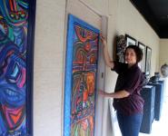 Christina Jarmolinski's Art in gallery window with Salina her assisstent 