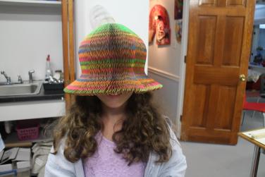 Fun in the studio  with a hand made paper hat 